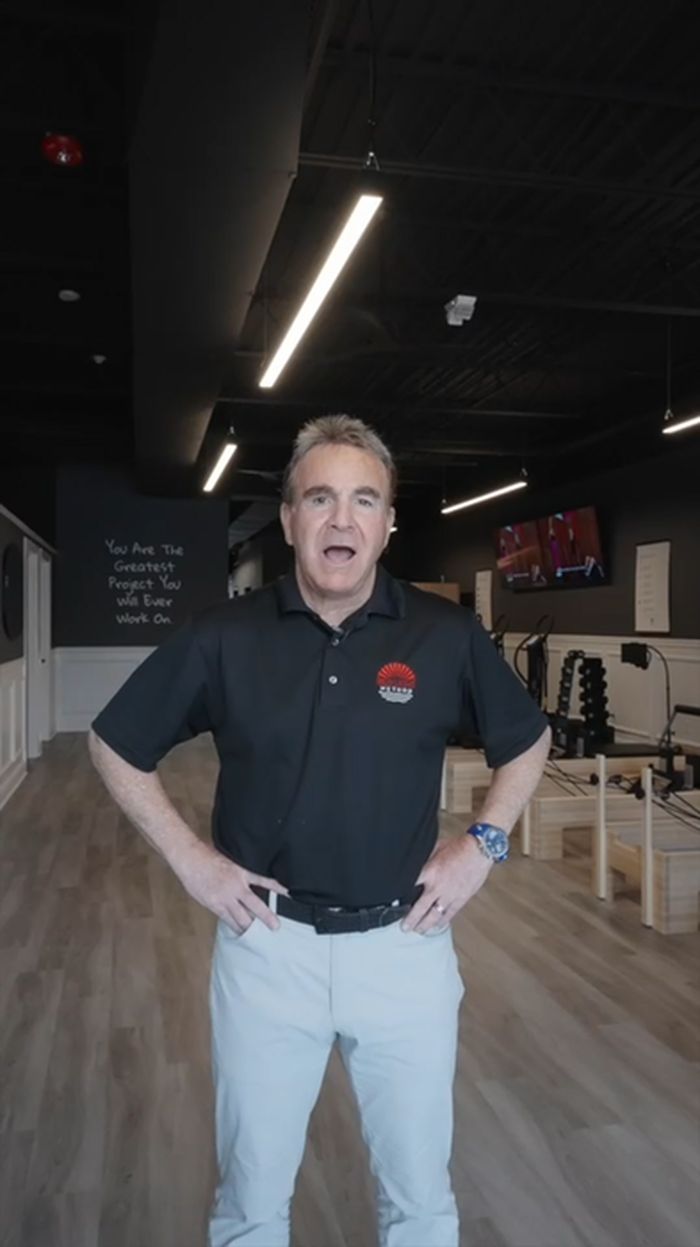 Owner Steve Berlin standing in the Red Light Method Commack studio.